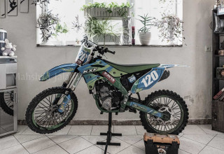 A view of her motorcycle in the living room. She does not have a parking garage in his house.