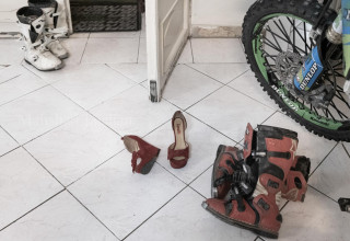 her shoes represent the feminine tendency and the heroine tendency on same time.